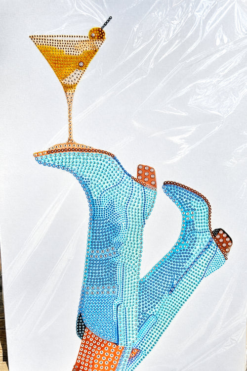 A diamond painting canvas featuring a stylized illustration of legs in cowboy boots and a martini glass.